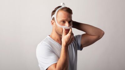 Male patient wearing a CPAP mask