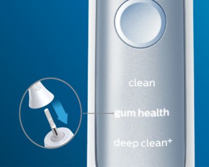 Handgreep van elektrische tandenborstel die de Gum Health-modus selecteert