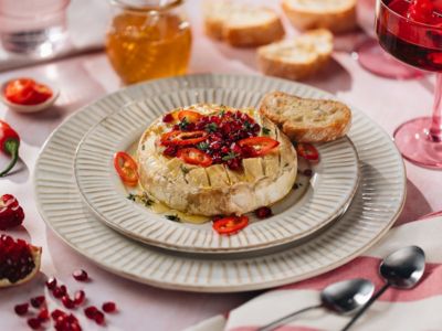 Baked camembert with pomegranate and honey served with bread