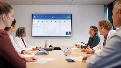 Professionals discussing oncology tumor data