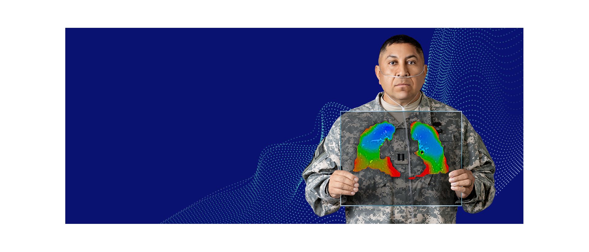Veteran holding up image of advanced lung imaging software