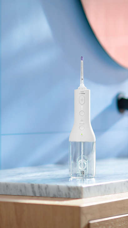Philips Sonicare Cordless Power Flosser standing on a countertop