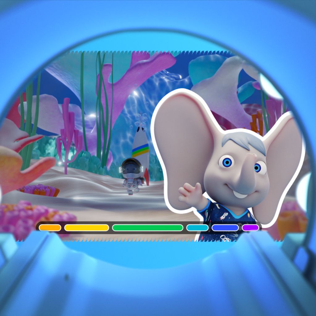 Ambient Experience paediatric theme Ollie waving in the MRI bore