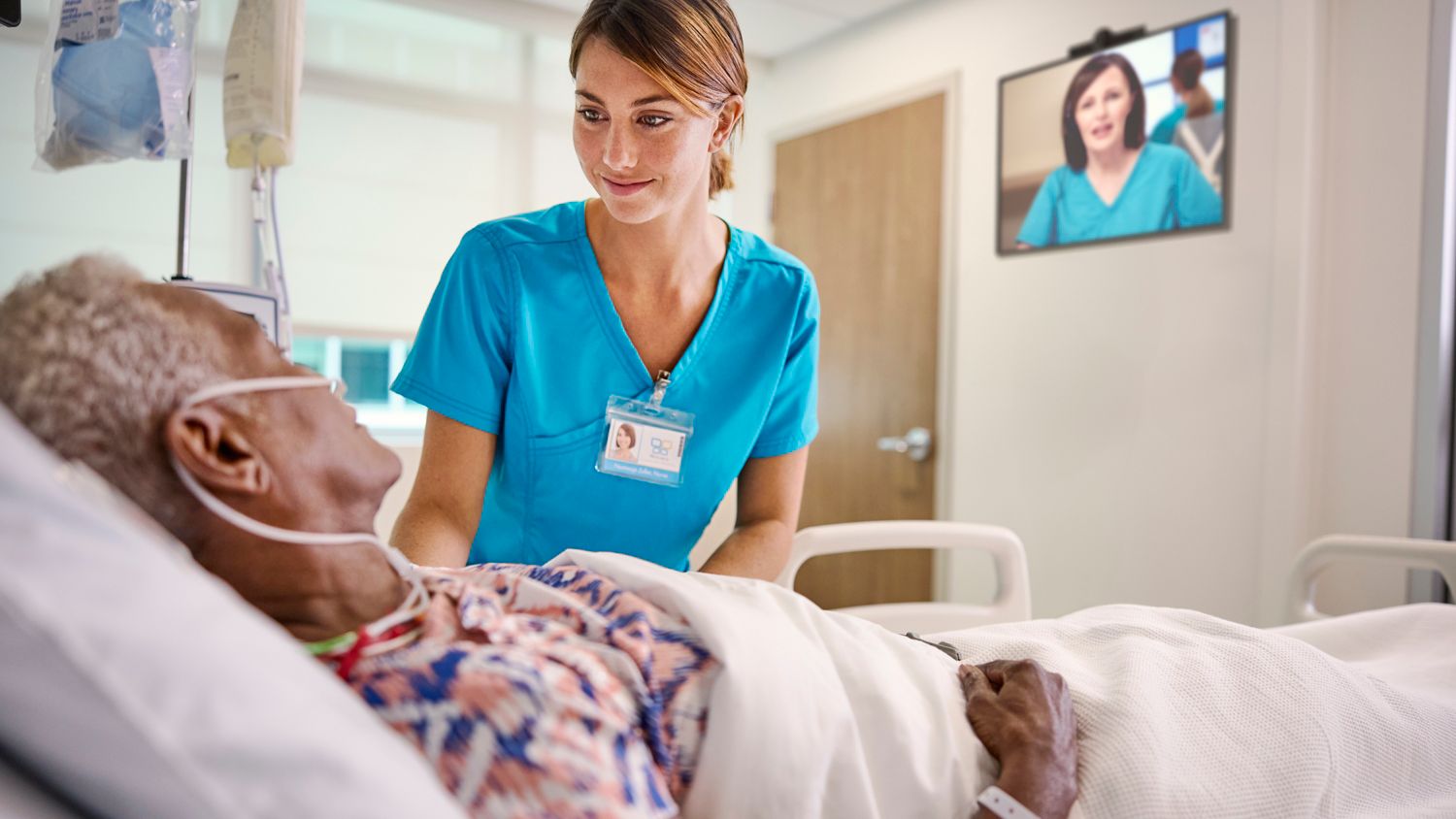 Bedside and virtual nurse provide care to patient