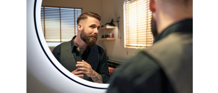  Two brown-haired men’s faces, one with 1cm short beard and the other a full beard and moustache.