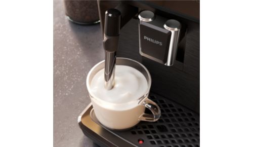 Premium Photo  Cafetera profesional haciendo dos cafs con leche en taza de  cermica
