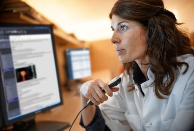 A radiologist dictating a report
