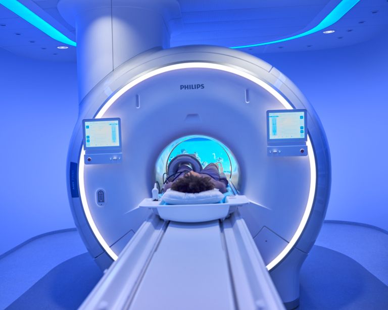 Patient lying in an MRI for a knee scan done with the latest MRI clinical applications available