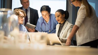 Hospital staff having a discussion in a medical setting