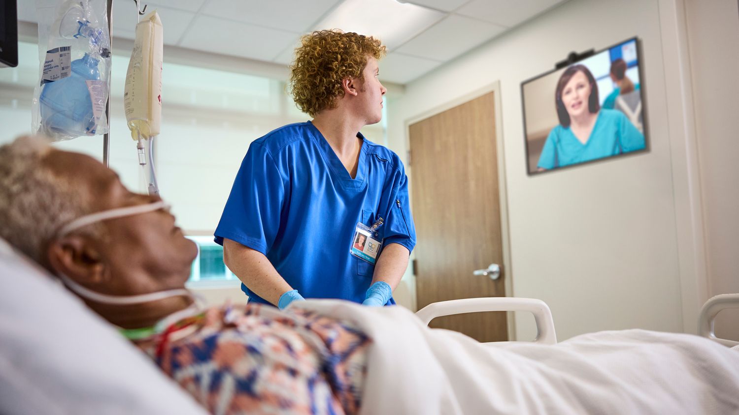 Bedside nurse looking at remote nurse