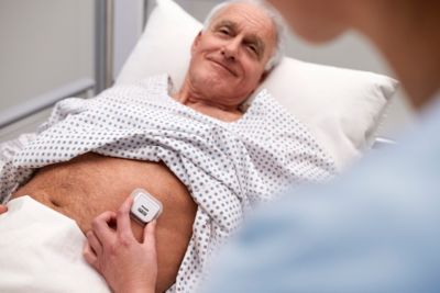 Patient using Healthdot biosensor for health monitoring