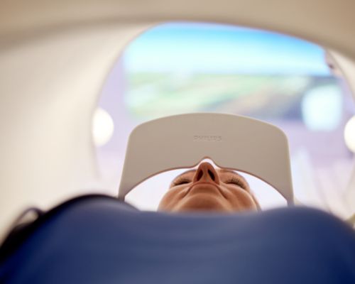 Ingenia Elition S - patient lying in the bore with Ambient Experience In-bore Connect.