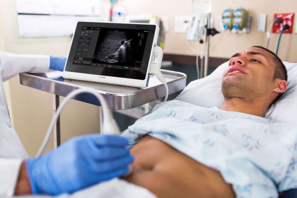 InnoSight ultrasound machine application photo featuring patient being scanned. 