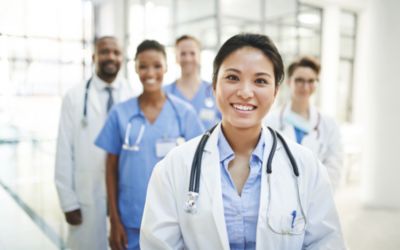 Medical professionals standing together in a hospital corridor