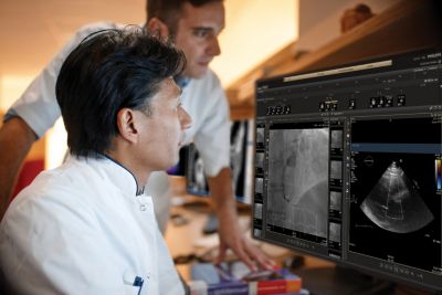 Two clinicians reviewing patient cardiovascular images using Philips IntelliSpace Cardiovascular system