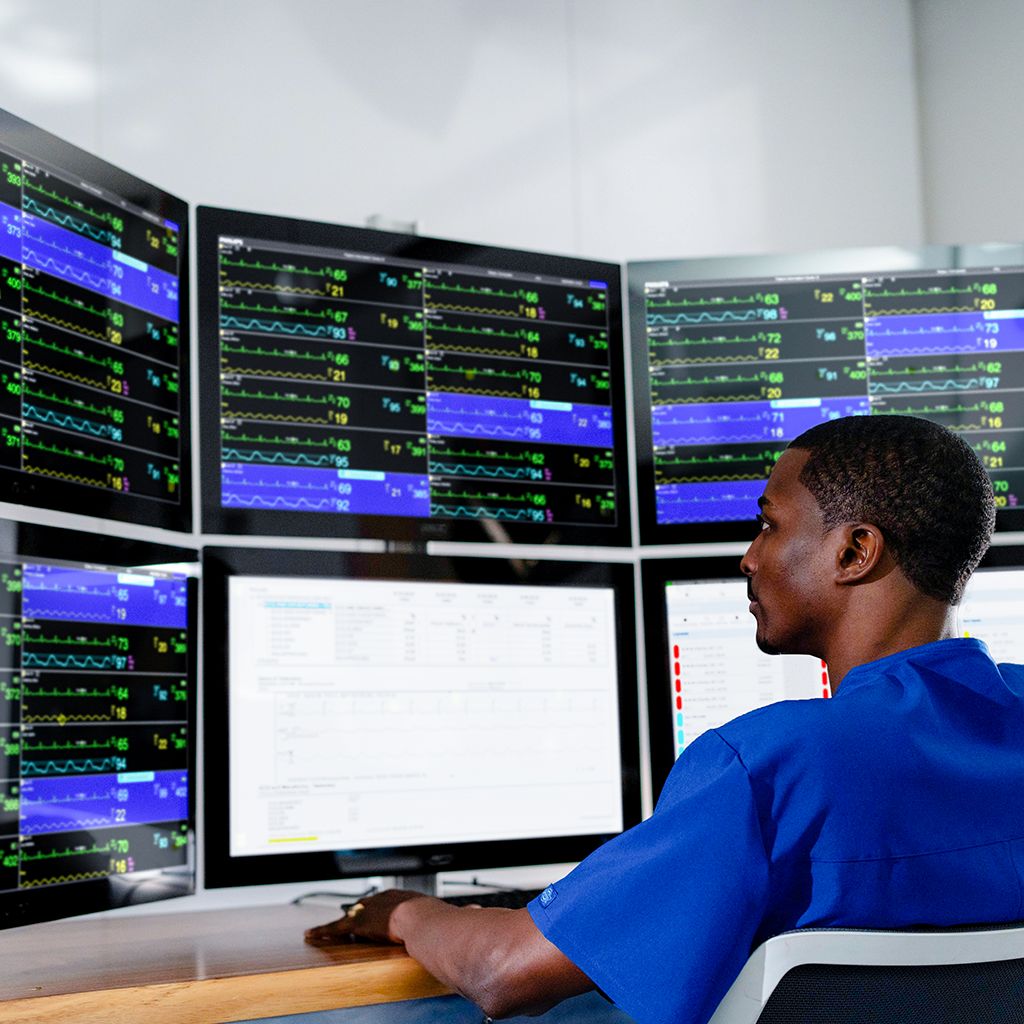 IDN technician reviewing monitors