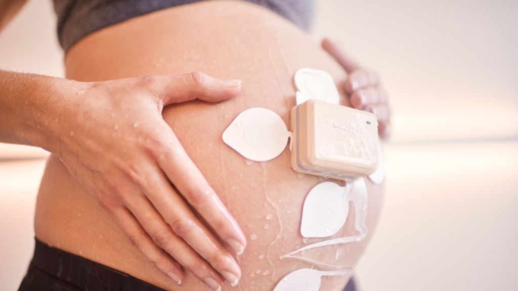 Mom in shower with beltless pod and patch