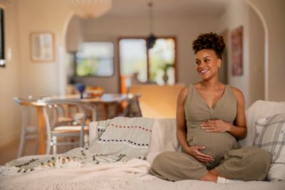 Pregnant woman sitting on couch