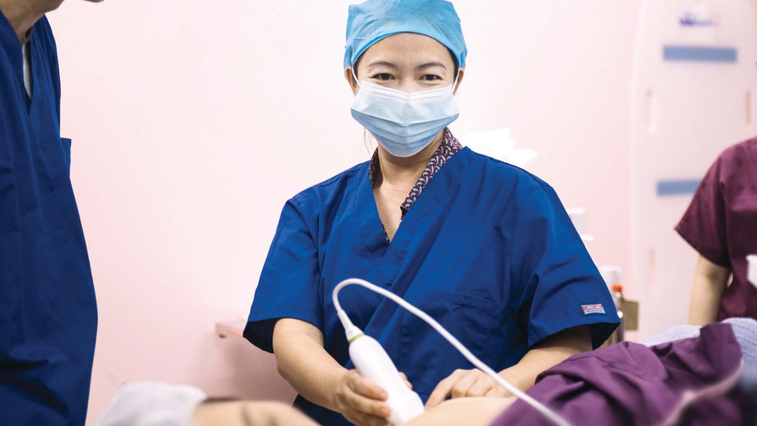 Dr. Felicia Tan uses the Lumify L12-4 linear transducer to complete a breast scan