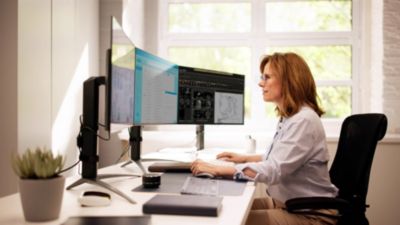 Cardiologist reviewing cardiovascular images on cloud based workspace