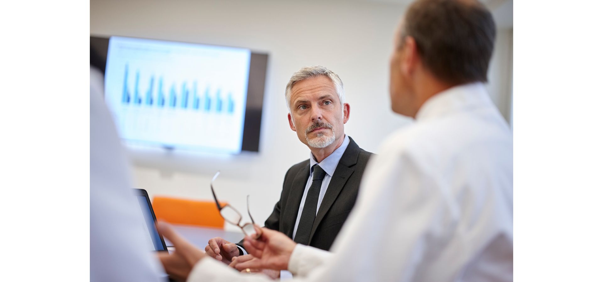 A group of men in a meeting