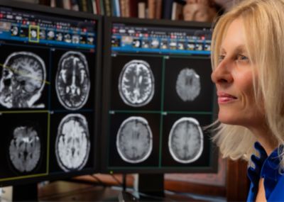 Dr. Suzie bash, neuro radiologist, looking at clinical images of the brain