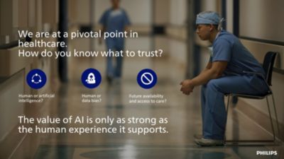 Healthcare professional seated in hospital corridor with message about trust in AI