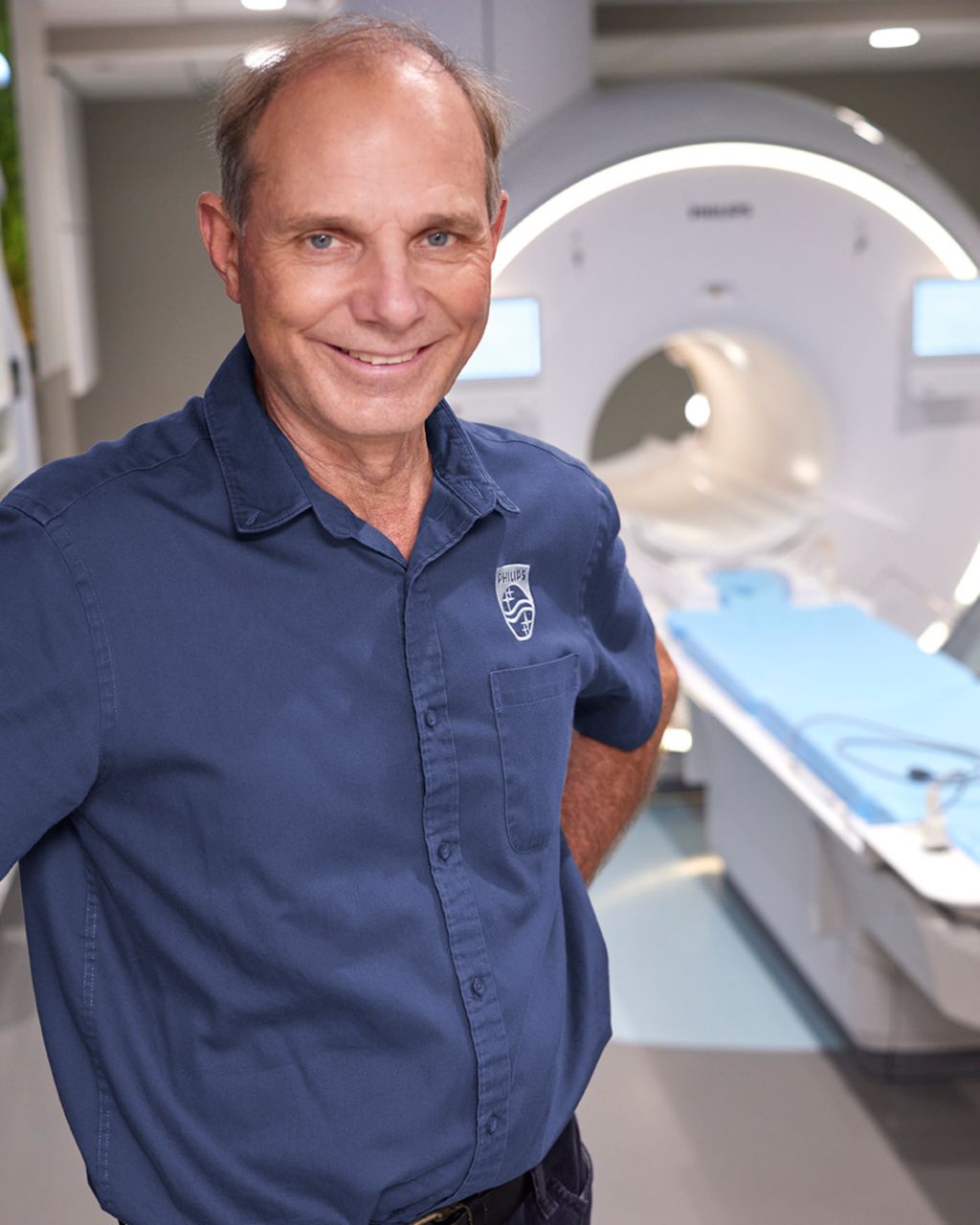 Philips field service engineer with scanner in background