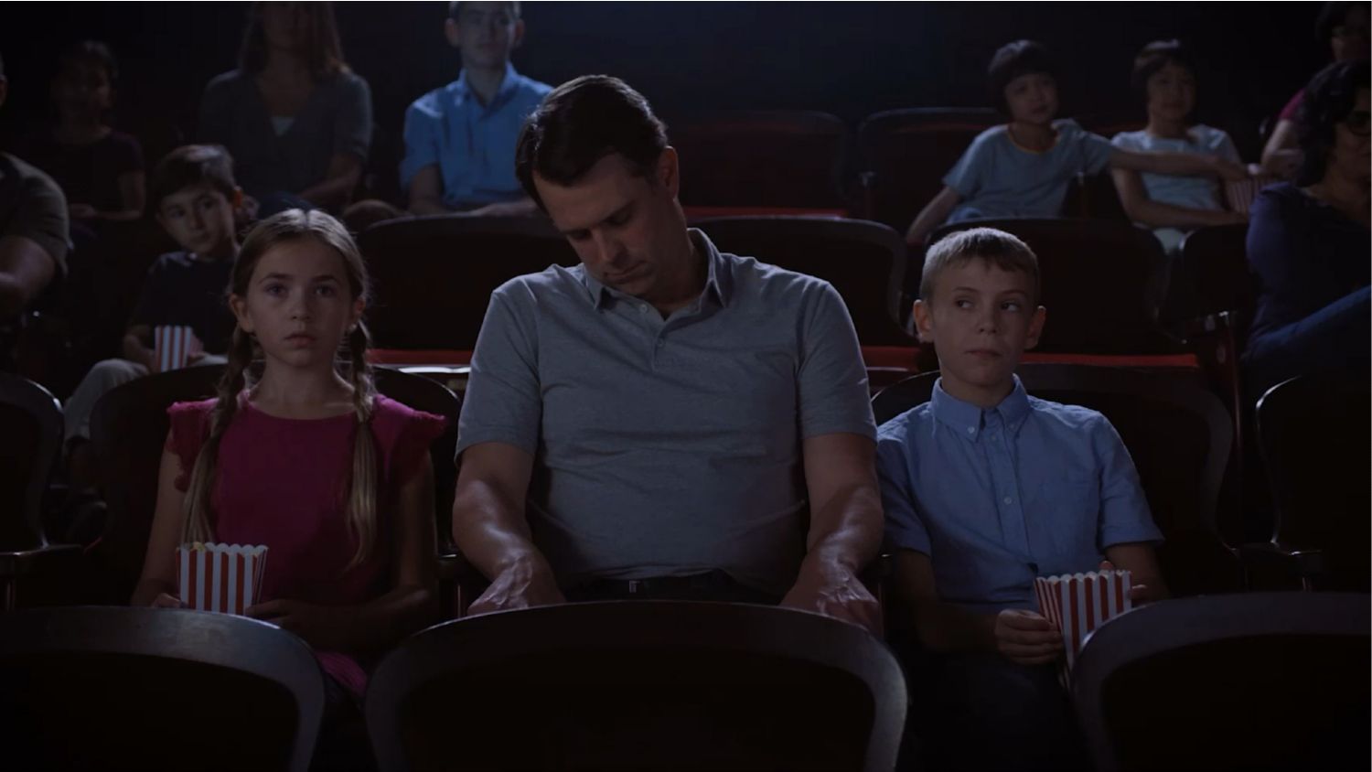 Father falling asleep in theater