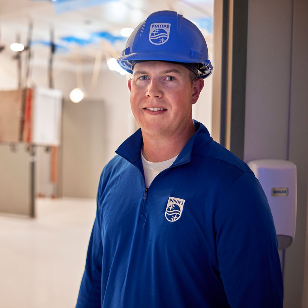 Philips field service engineer taking a remote service call