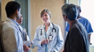 A group of medical professionals discussing in a hospital setting