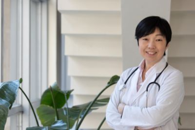  A healthcare professional in a white lab coat with a stethoscope