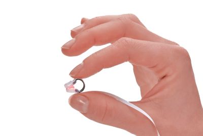 Alar being held in between pointer finger and thumb