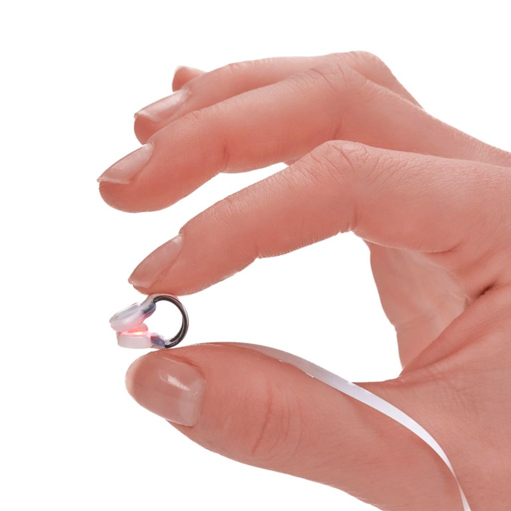 Alar being held in between pointer finger and thumb