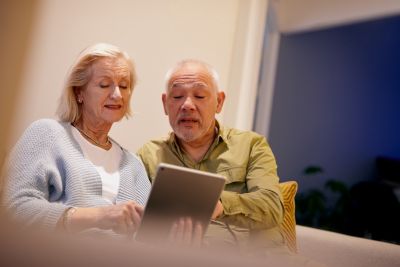 Elder couple using a digital screen together