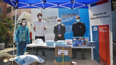 Mobile clinic setup with healthcare professionals and medical supplies in Antofagasta Chile
