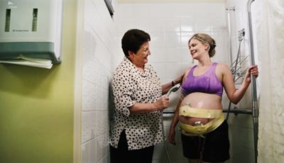 Transducers being placed on a pregnant patient