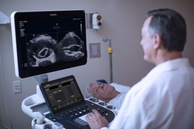   Clinician performing ultrasound exam on elderly patient

