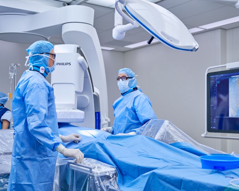 A group of doctors in a surgery room