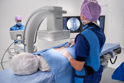 Clinicians performing image-guided procedure using Philips Zenition C-arm platform