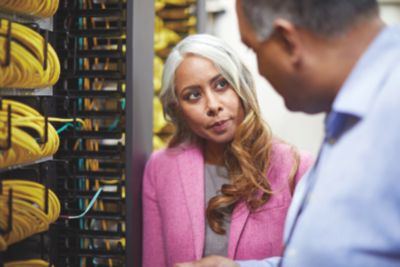 CIO and IT professional in network room