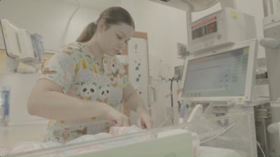 Nurse taking care of infant