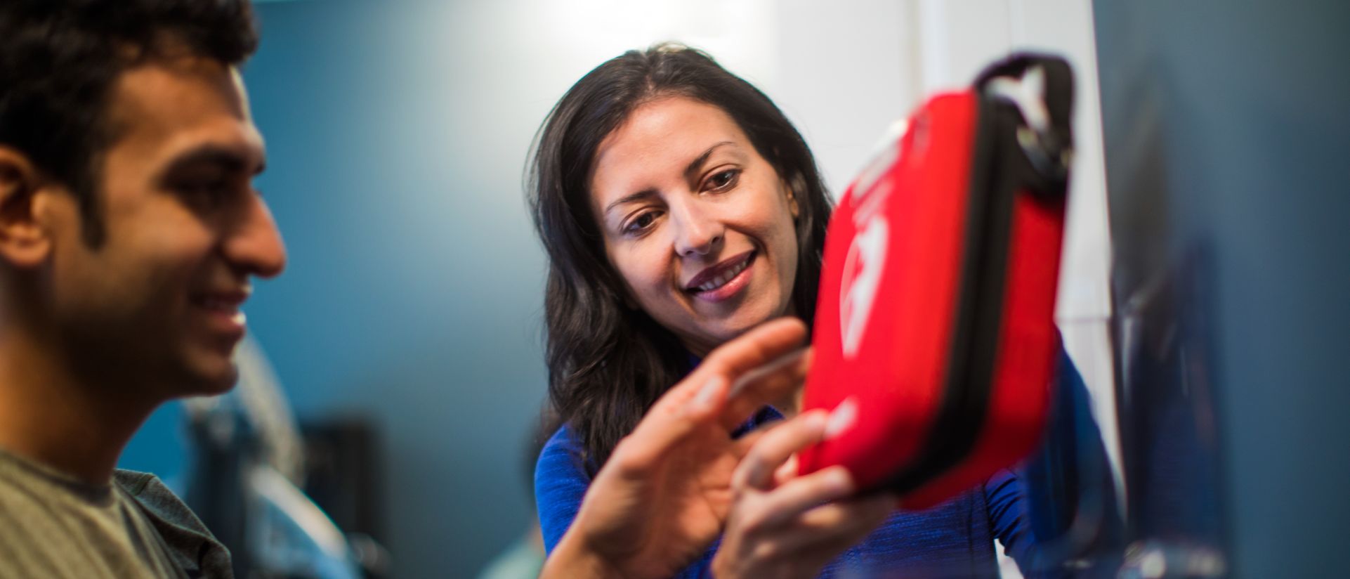 Woman and man using an AED device