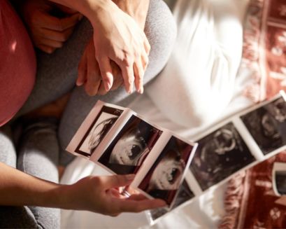 Person using the Pregnancy⁺ app on phone