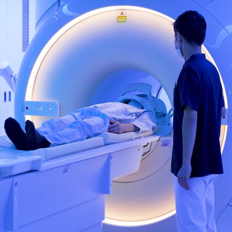 Undergoing an MRI exam while watching an Ambient Experience theme