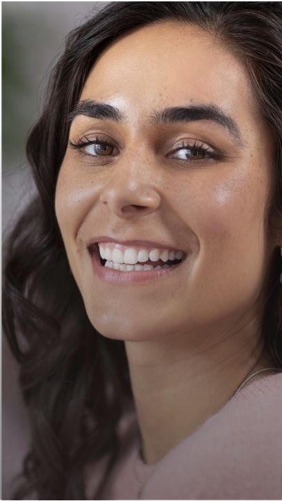 A patient with braces is smiling.