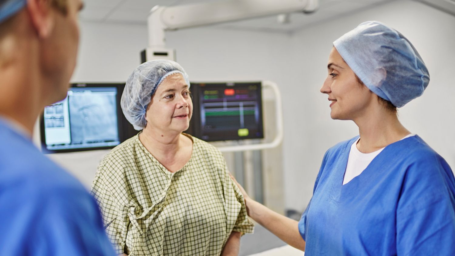 Nurse comforting patient prior to an interventional procedure