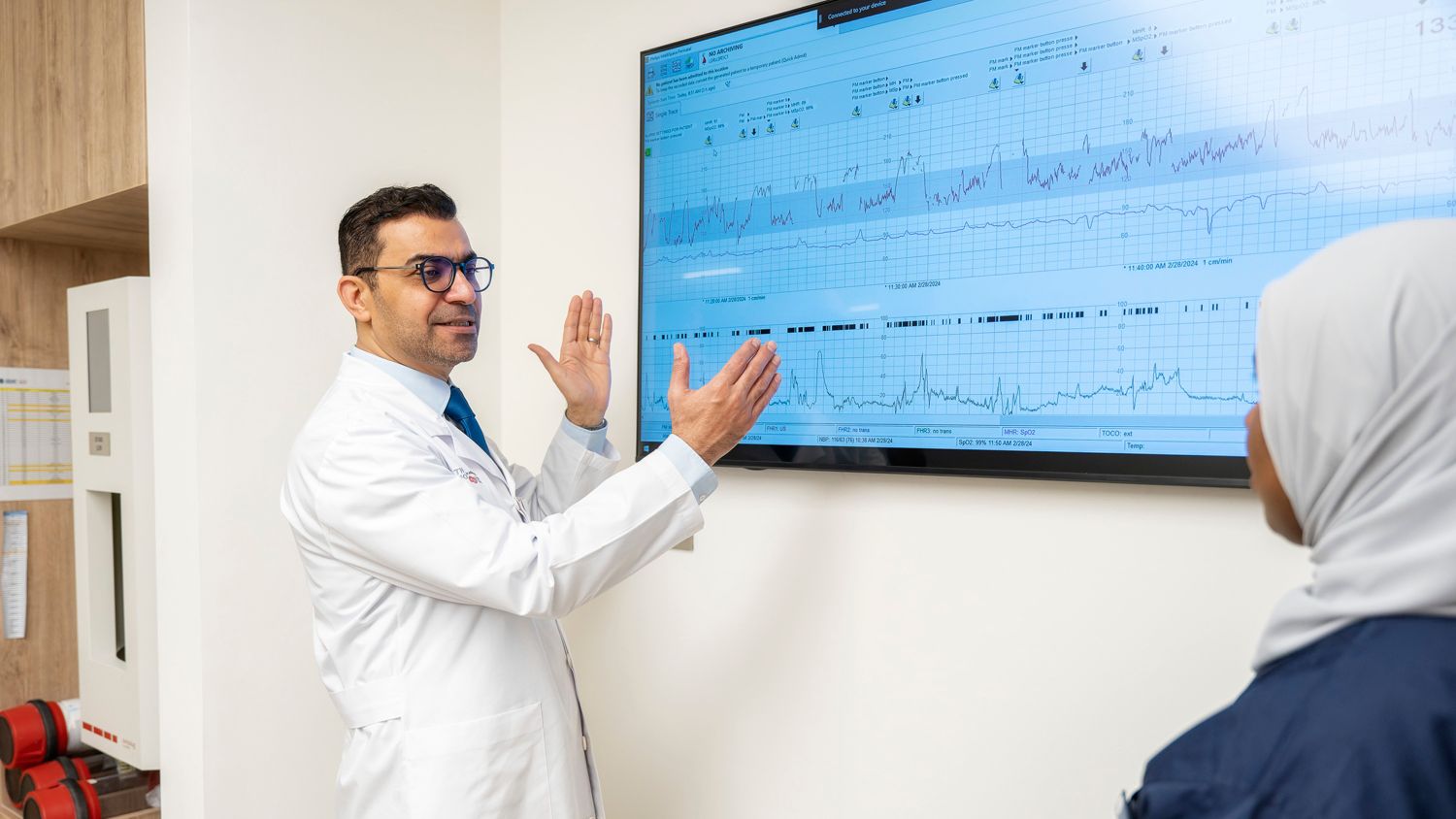 Clinician observing IntelliSpace Perinatal on large screen