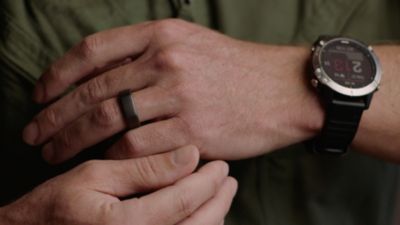 Person wearing smart ring and smartwatch used for AI infection risk monitoring