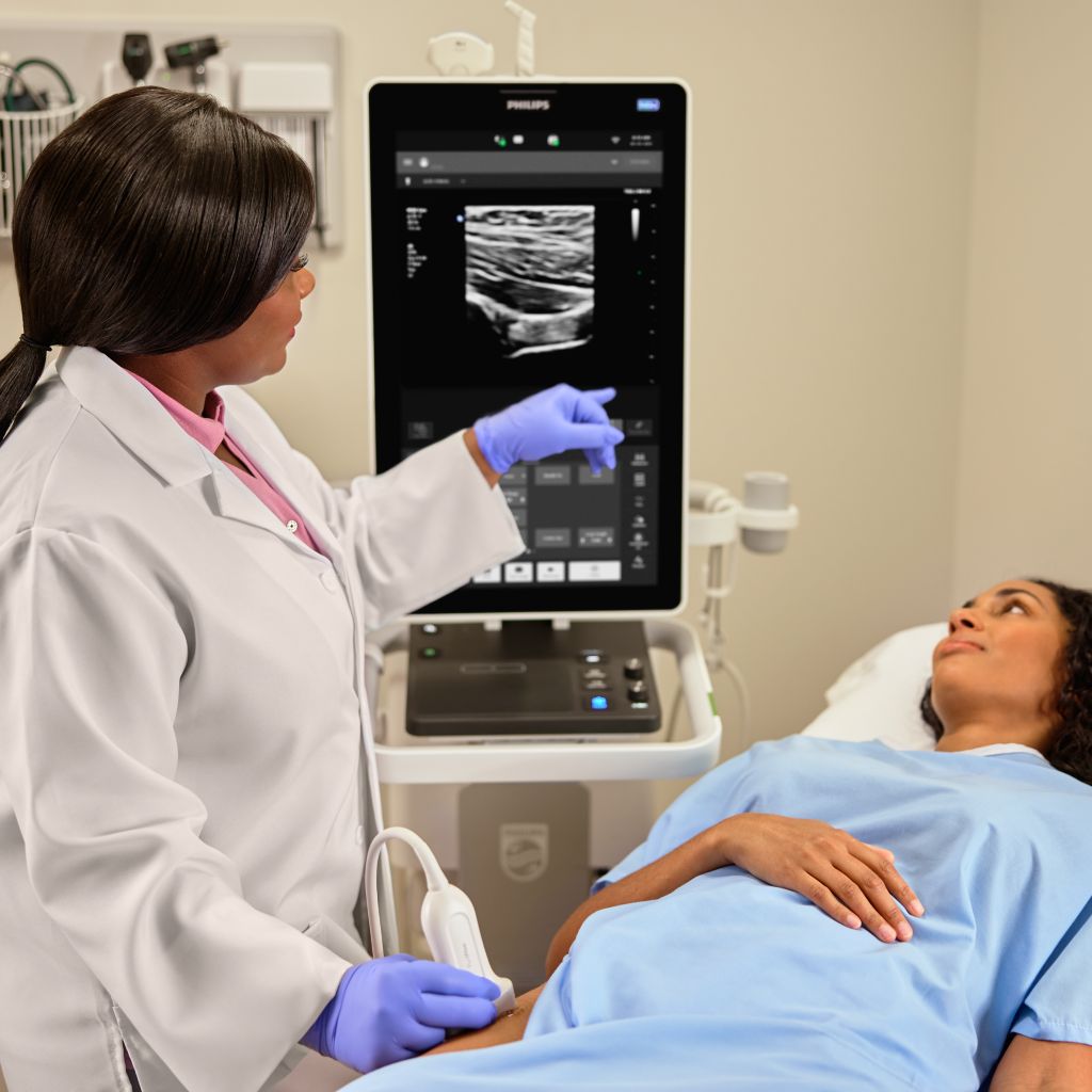 MSK clinician taking hip scan image on mobile ultrasound system